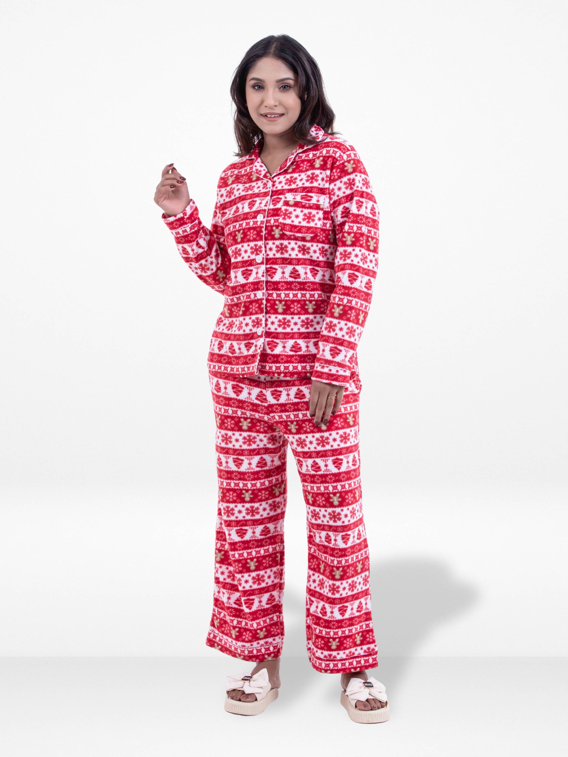 Woman wearing a red and white patterned onesie on a white background