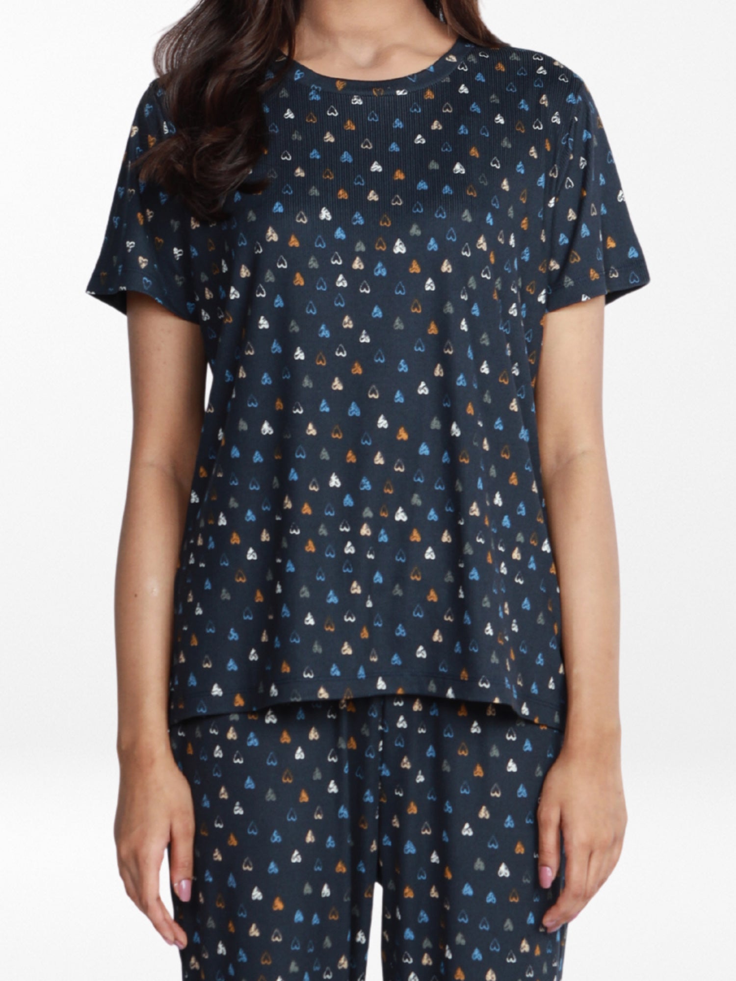 Navy pajama set with small pattern worn by a person on a white background